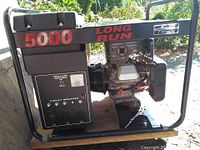 Front view showing control panel with outlets and engine housing