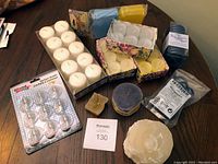 Overview of various candles and decor items on table