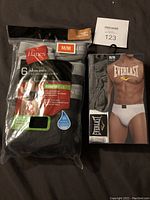 Photo of packaged 6-pack Hanes briefs and 3-pack Everlast briefs, front packaging visible.