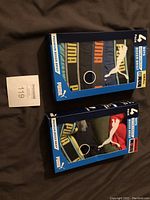 Two boxes of Puma boys boxer briefs, one size small and one size medium, each containing 4 pairs, stacked side by side.