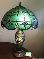 Front view of lit lamp showing overall design and color