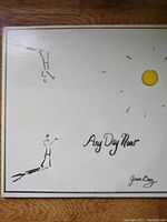 Front cover of Joan Baez album 'Any Day Now' with simple line drawing and signature.