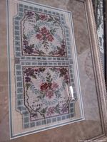 Pair of floral glass-beaded bag panels framed behind glass with double matting.