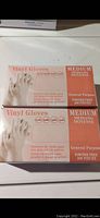 Box front with vinyl gloves labeled medium size, 200 pieces, powder free, no latex for general purpose use.