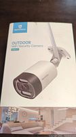 Photo of the HeimVision HM311 outdoor wifi security camera box showing product image.