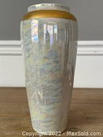 Front view of the Limoges opalescent vase showing iridescent colors and gold rim.