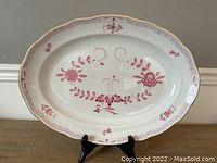 Front view of oval platter on stand showing full Pink Indian floral pattern