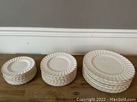 Stacked view of all plates showing distinct sizes indicating dinner, salad and cake plates
