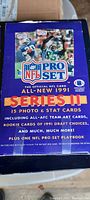 Photo of one sealed 1991 NFL Pro Set Series II football card store box with graphics and text detailing the product contents and features.