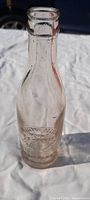 Full bottle visible on white background displaying overall shape and condition.