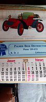Full size 1972 calendar page featuring a red 1902 Hayes-Apperson antique car illustration with Palmer Beer Distributor contact info and Pabst Blue Ribbon logo.