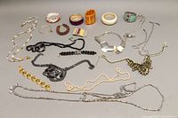 Overview of assorted costume jewelry including bangles and necklaces