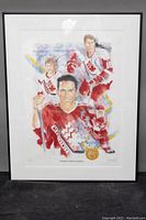 Framed limited edition print showing four Canadian hockey players in watercolor style with signatures at bottom right.