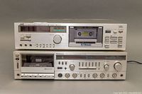 Front view of stacked JVC DD-5 cassette deck and Technics SA-R40 receiver showing overall appearance