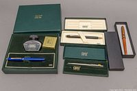 Full lot with four writing items and original packaging showing the CROSS branding and condition of items