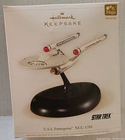 Box showing the Hallmark Keepsake branding and image of the Star Trek U.S.S. Enterprise NCC-1701 ornament with stand. Indicates Magic Sound and Light feature.