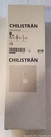 Photo of the original packaging box, with the name Chilistran and reference to the hanging planter use and size 4 inches.