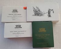 Original boxes for Department 56 Heritage Village Collection porcelain items: Snow Children, Don't Drop The Presents, The Holly and The Ivy event piece.