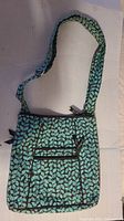 Front view of Vera Bradley hipster bag showing full strap and front zippered pocket with leaf pattern