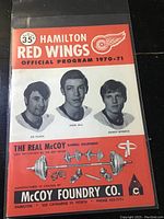 Front cover showing three player portraits (Joe Talaga, Owen July, George Beveridge), McCoy Foundry Co. advertisement, and program title for 1970-71 season.