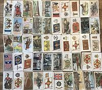 Front sides of 50 John Players and Sons cigarette cards with different vintage illustrations and themes