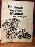 Front cover of Harley Davidson Panhead Service Manual for 1948-1957 rigid frame models showing title and illustration of engine and motorcycle.