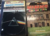 Photo showing stack of vinyl records with Pink Floyd Dark Side of the Moon visible in front, alongside other rock albums such as Paul Revere and the Raiders and Cledus Maggard & The Citizen's Band.