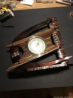 Top view of Veglia Boomerang Table Clock showing the rare striped wood grain bakelite body and round dial clock face.