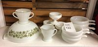 Group photo showing Pyrex Spring Blossom large mixing bowl with green floral band, Fire King swirl gold handled creamer and sugar bowl, Anchor Hocking opal white handled skillets and dessert dishes.