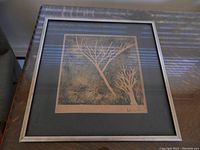 Framed print showing the full artwork with branches and the frame detail.