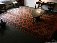 Full view of rectangular rug laid in room with furniture