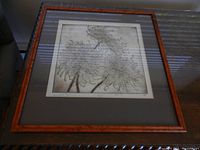 Framed artist proof print viewed from an angle showing overall artwork and frame.