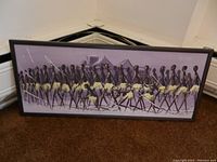 Full view of Korbel 'Slaves Walking' framed canvas painting lying on carpet, showing the whole piece and frame.