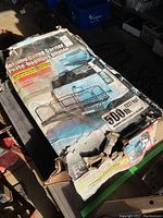 Original packaging box with visible product name and weight capacity details.