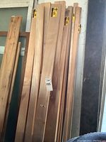 Stack of S4S 1×4×72" maple boards leaning against wall
