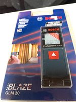 Front photo of Bosch Blaze GLM 20 laser measure in sealed retail packaging showing the brand, model, and measurement capabilities.