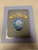 Front of decorative box showing Disney Magical Tales logo and castle illustration