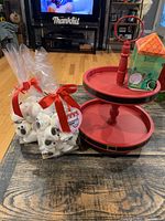 Two packs of polar bar marshmallows, a box of Lord Lancaster herbal infused tea on the two-tier Santa tray, displayed on table in living room.