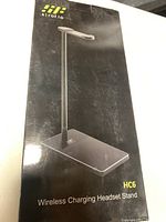 Front of box showing the HC6 Wireless Charging Headset Stand product image and branding