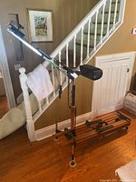 Full length photo of the Nordic Track exercise machine showing the overall structure, skis, seat and control panel.