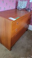 Front angle view showing the dresser from top side focusing on overall condition and veneer surface