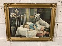Full view of framed print showing child sleeping on brass bed with dog sitting beside.