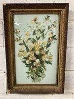 Full view of the framed painted glass floral artwork showing entire piece and frame in situ.
