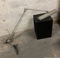 Full view of vintage drafting desk light showing adjustable metal arm, clamp base, and power cord.
