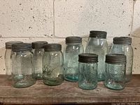 All 10 vintage Crown and Ball canning jars in varying sizes grouped together for scale and condition.