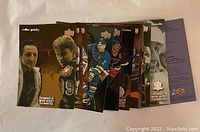 Stack of 13 Wayne Gretzky hockey cards from McDonald's with different images on each card and metallic star logo.