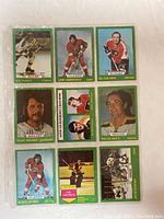 Front sides of nine hockey cards from 1973-74 O-Pee-Chee set showing player images and names.