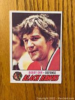 Front of Bobby Orr 1977-78 O-Pee-Chee hockey card showing player portrait and team logo