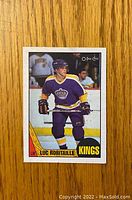 Front side of Luc Robitaille rookie card showing player in Kings uniform with name and team.