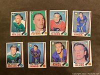 Front side of 8 vintage 1969-70 O-Pee-Chee hockey cards showing players in various NHL team jerseys.